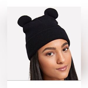 Black knitted beanie with mouse ears.